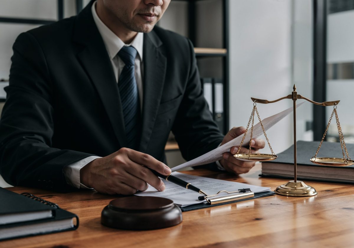 Lawyer Local SEO; lawyer-working-document-with-scales-justice