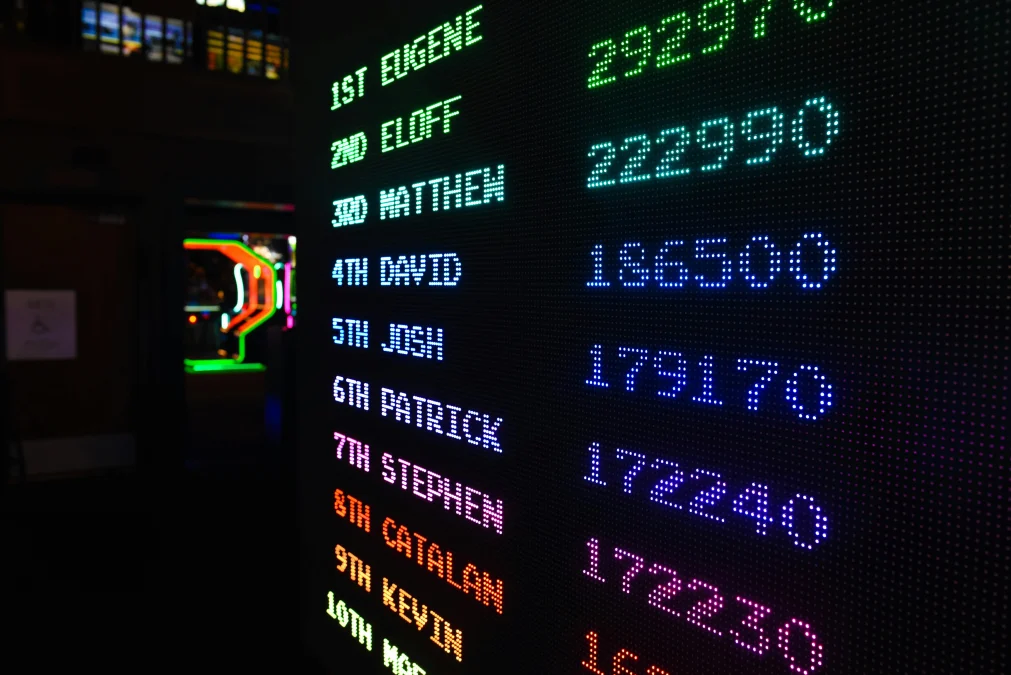 Colorful illuminated scoreboard displaying high scores representing community rankings and leaderboards