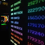 Colorful illuminated scoreboard displaying high scores representing community rankings and leaderboards