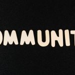 Community text on dark background representing online community moderation